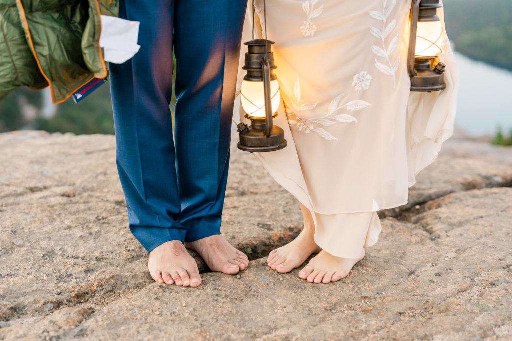 couple standing barefoot on a mountain for their Alaska Elopement